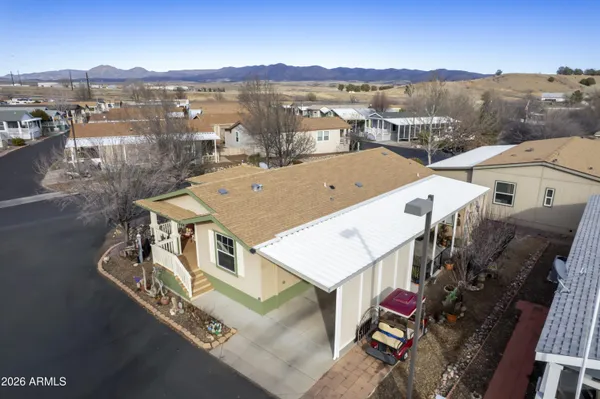 an aerial view of a house with a lake view