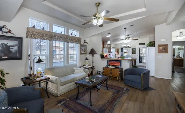 a living room with furniture and a large window