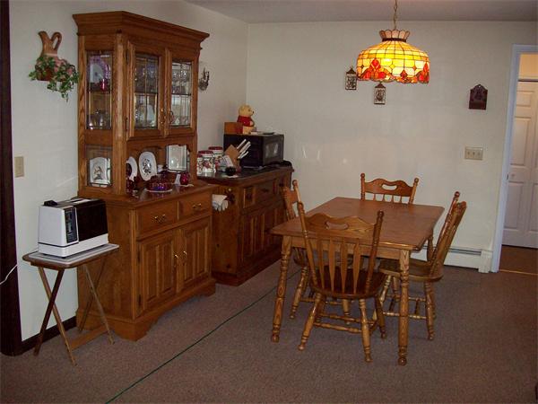 266 Ramshorn Road Dudley, MA 01571 - Photo 8 of 17 a view of a dining room with furniture and chandelier