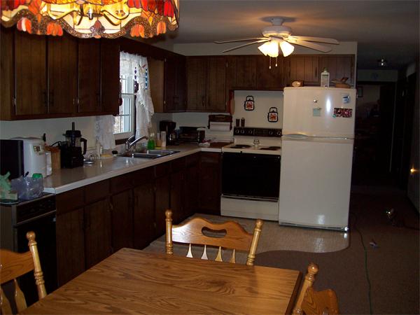 266 Ramshorn Road Dudley, MA 01571 - Photo 9 of 17 a kitchen with a sink a stove a refrigerator and cabinets