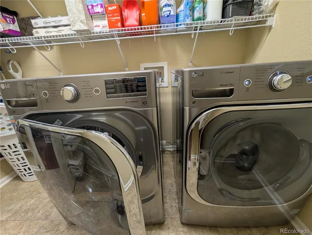 a utility room with washer and dryer