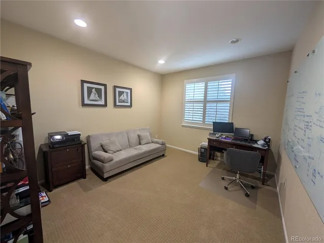 a bathroom with a sink toilet and a mirror