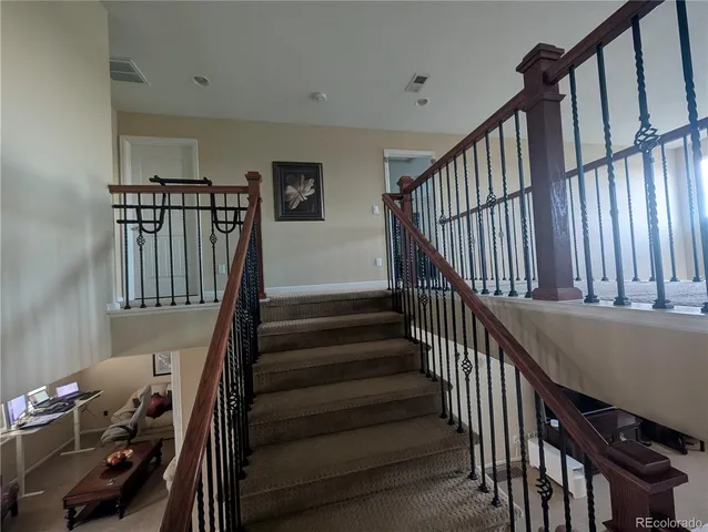 a view of living room with furniture and a flat screen tv