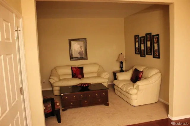 a bedroom with a bed and couch