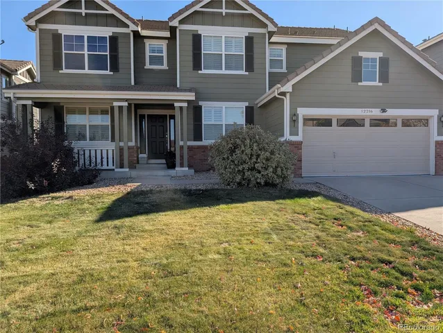 a view of a dining room with furniture and window