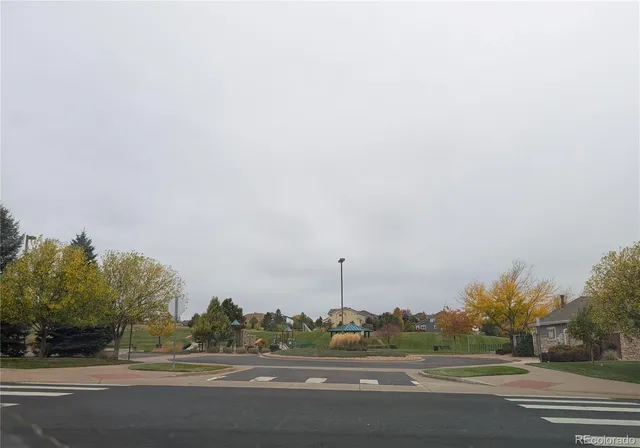 a kitchen with a table chairs sink and cabinets