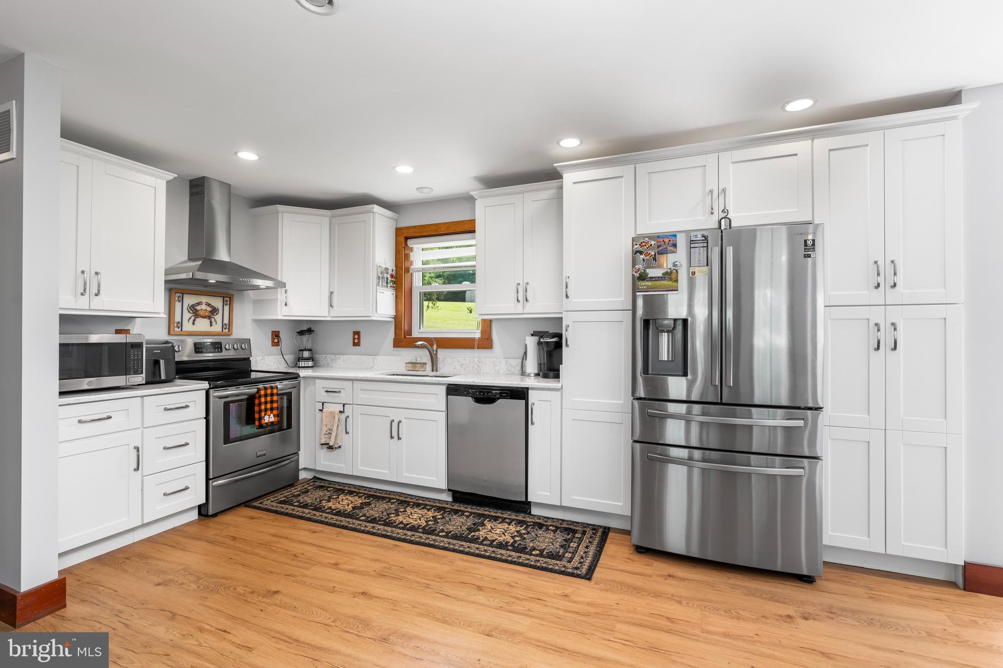 329 Everett Road Monkton, MD 21111 - Photo 12 of 41 a kitchen with stainless steel appliances a refrigerator sink and microwave