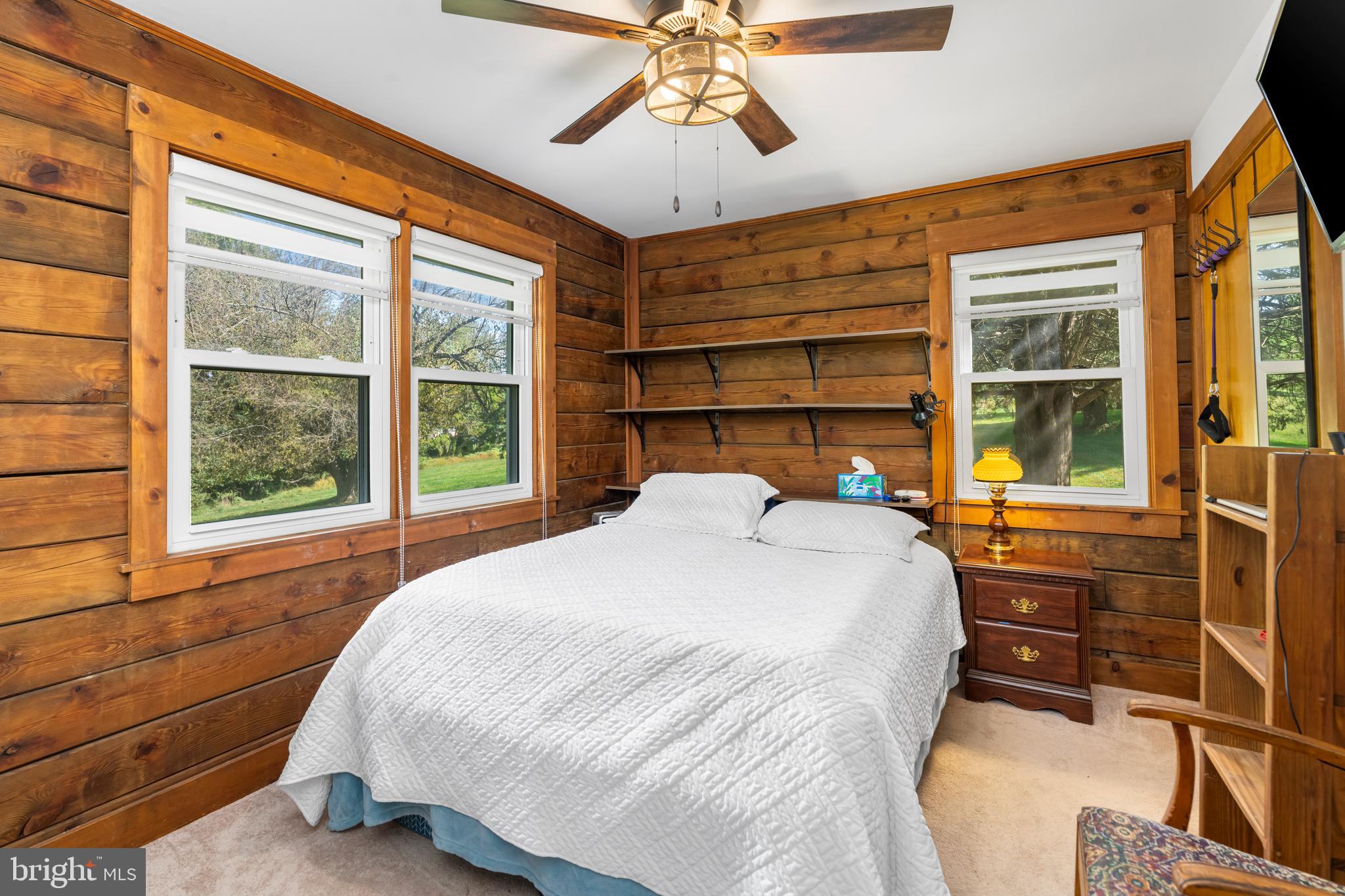 329 Everett Road Monkton, MD 21111 - Photo 19 of 41 a bedroom with a bed and a large window