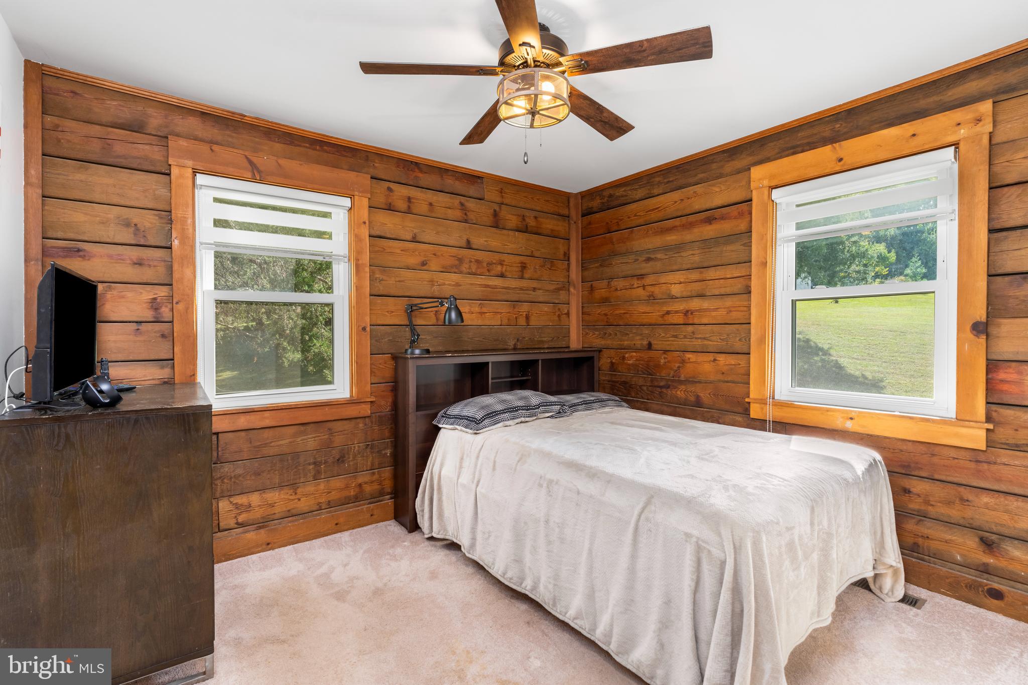 329 Everett Road Monkton, MD 21111 - Photo 20 of 41 a bedroom with a bed and a flat screen tv