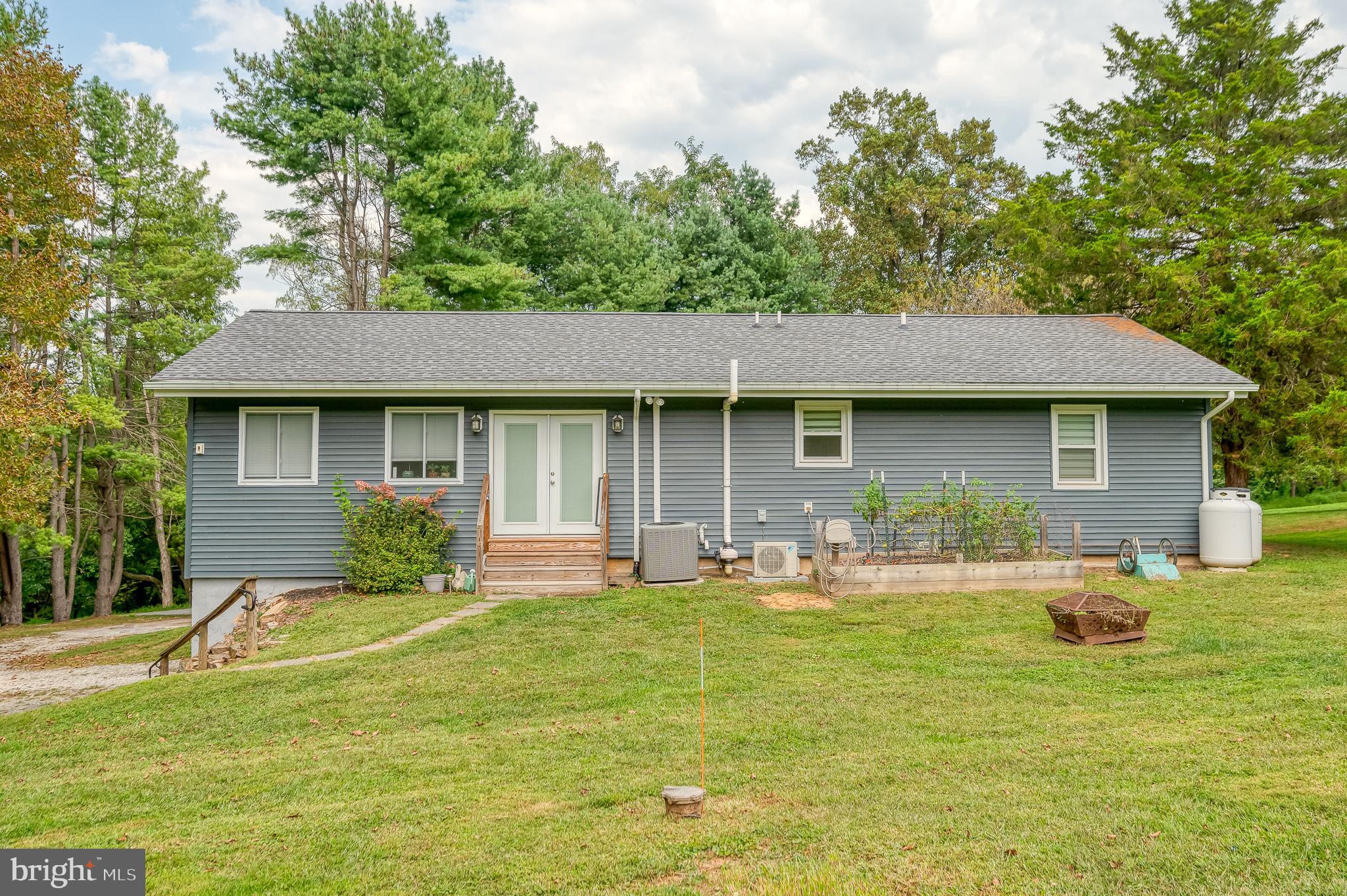 329 Everett Road Monkton, MD 21111 - Photo 3 of 41 a front view of a house with swimming pool and porch with furniture