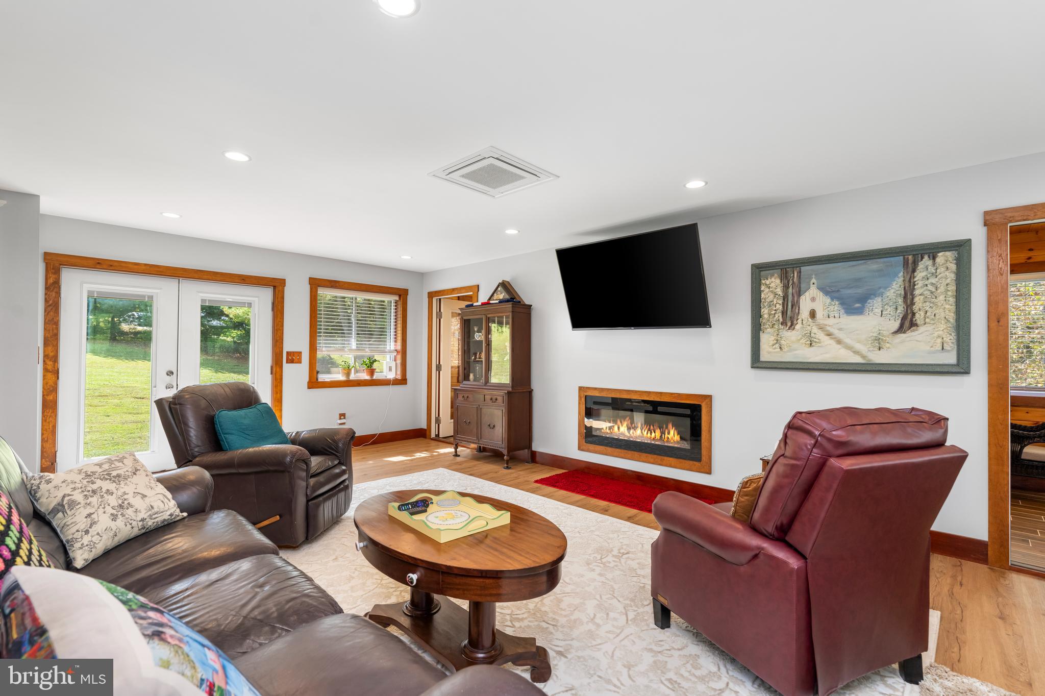 329 Everett Road Monkton, MD 21111 - Photo 5 of 41 a living room with furniture a fireplace and a flat screen tv