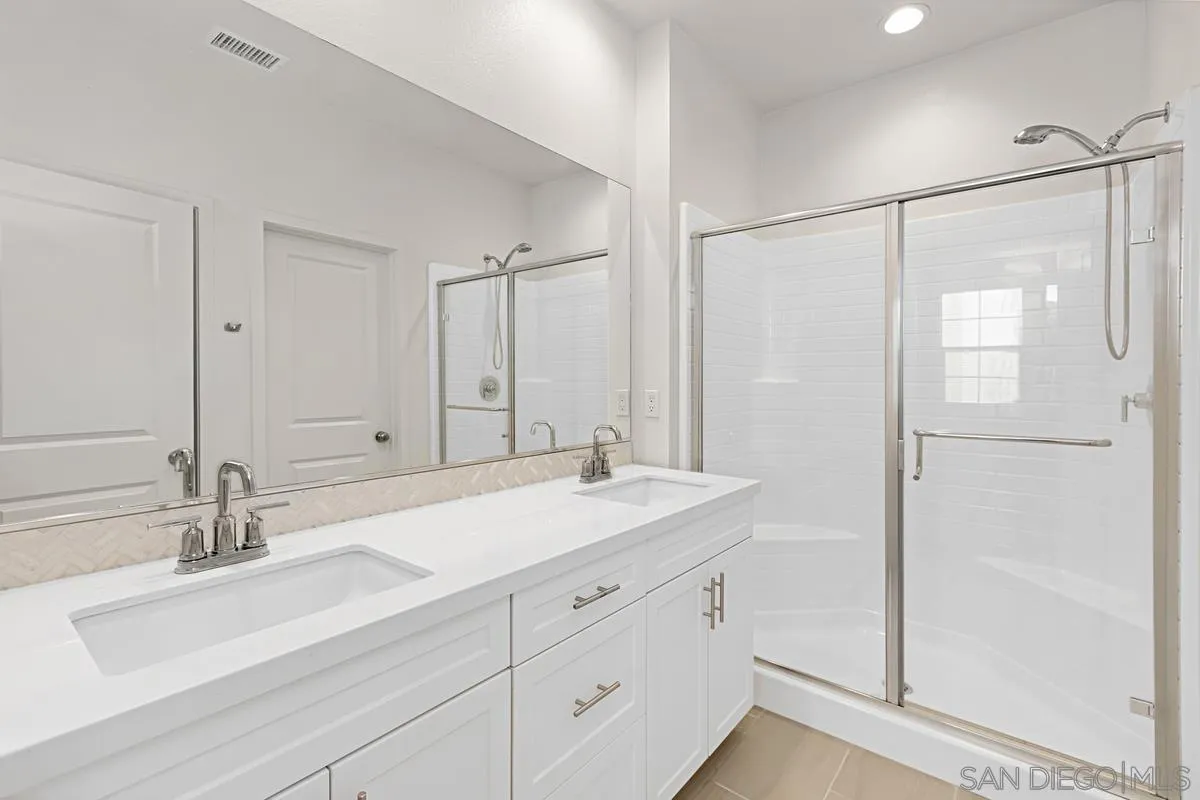 340 Millstream Court Santee, CA 92071 - Photo 16 of 19 a bathroom with a sink double vanity and a mirror