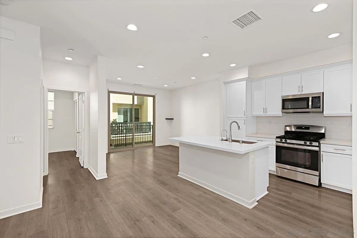340 Millstream Court Santee, CA 92071 - Photo 5 of 19 a kitchen with stainless steel appliances granite countertop a stove and a sink