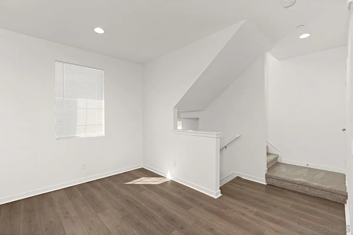 340 Millstream Court Santee, CA 92071 - Photo 10 of 19 an empty room with wooden floor and windows