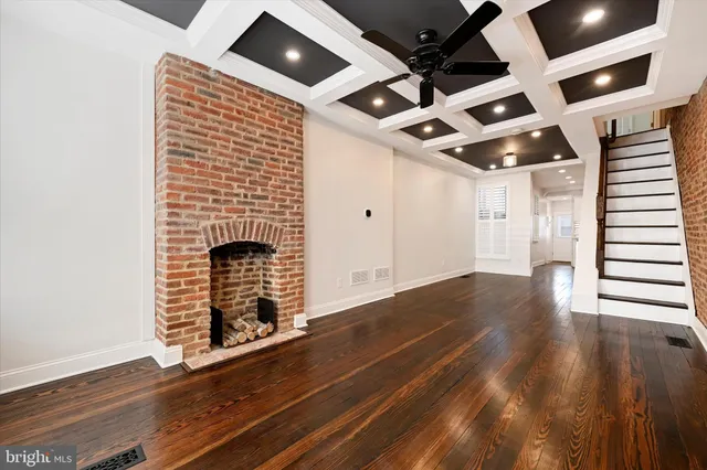 a view of an entryway with wooden floor