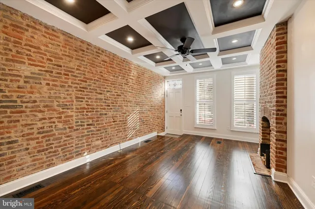 a view of an entryway with wooden floor