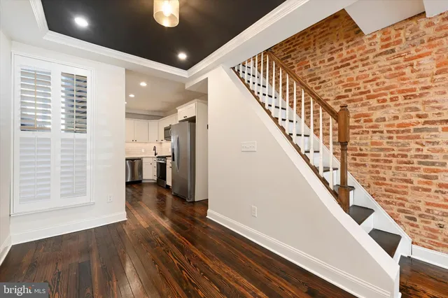 a view of entryway with wooden floor