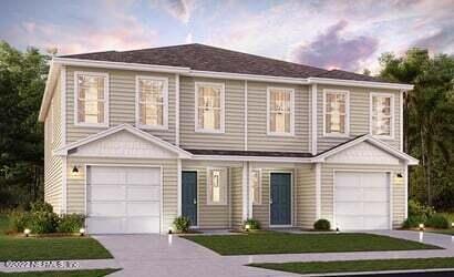 45113 Red Brick Drive Callahan, FL 32011 - Photo 2 of 9 a front view of a house with a yard and garage