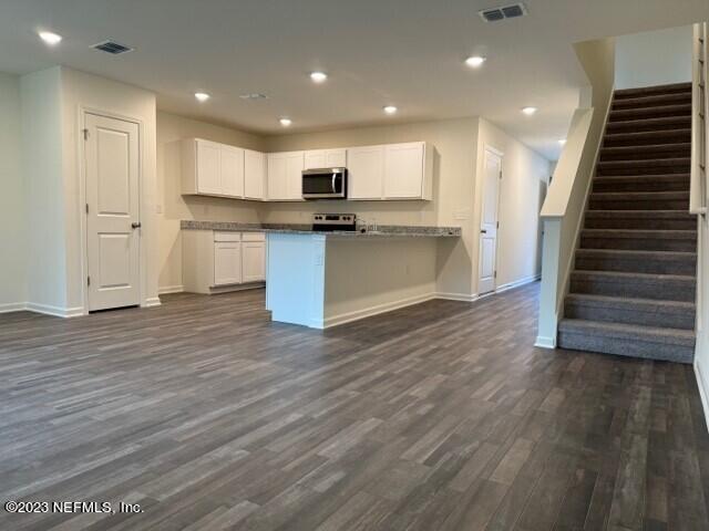 45113 Red Brick Drive Callahan, FL 32011 - Photo 6 of 9 a view of kitchen with wooden floor and electronic appliances