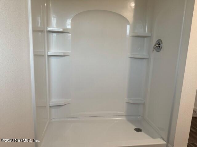 45113 Red Brick Drive Callahan, FL 32011 - Photo 7 of 9 a bathroom with a glass shower door