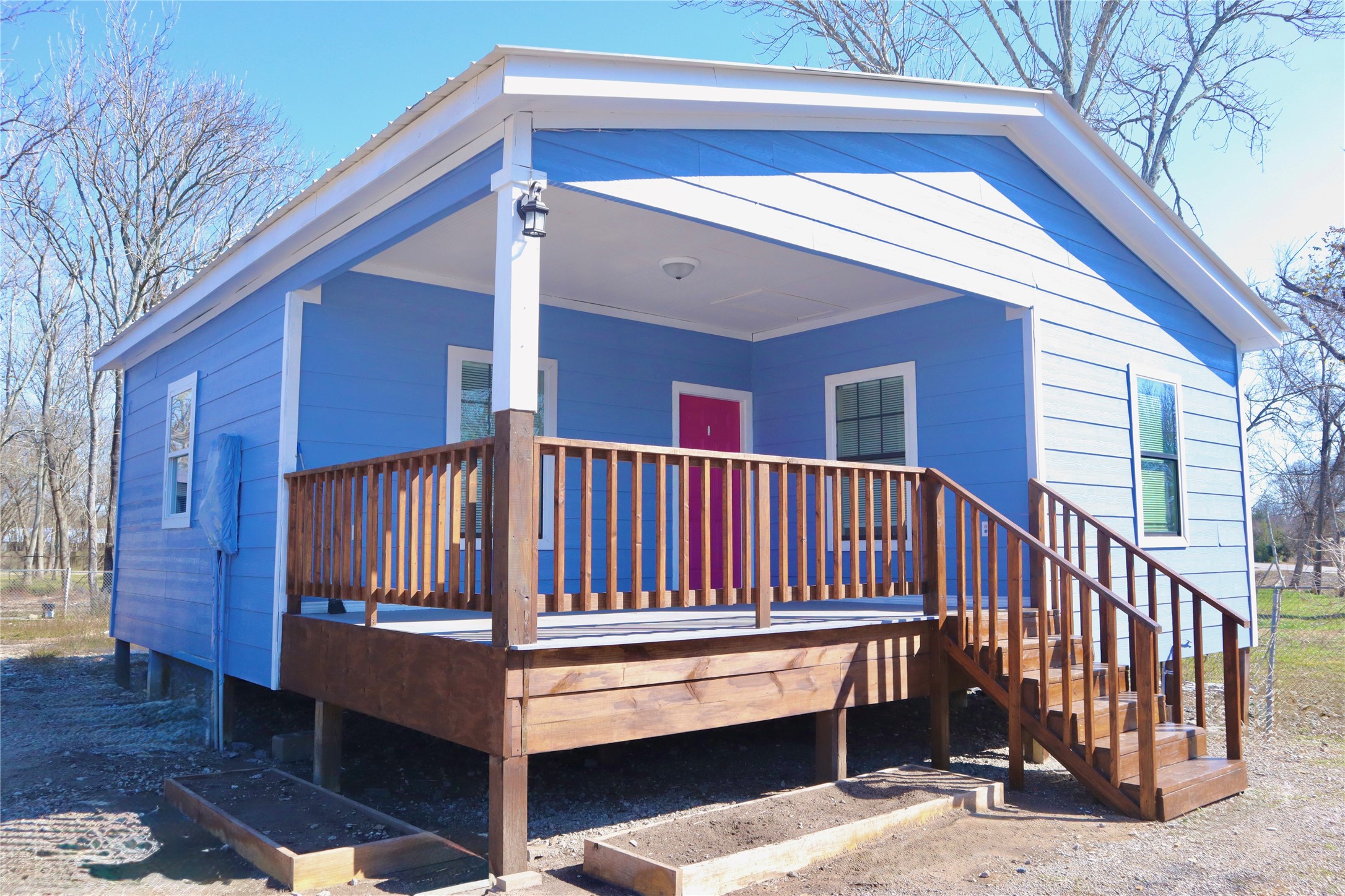 Charming front exterior featuring a covered outdoor patio—perfect for morning coffee or relaxing evenings.