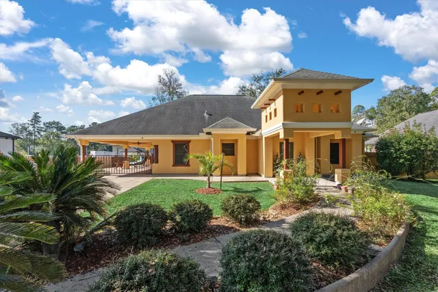 a front view of a house with garden