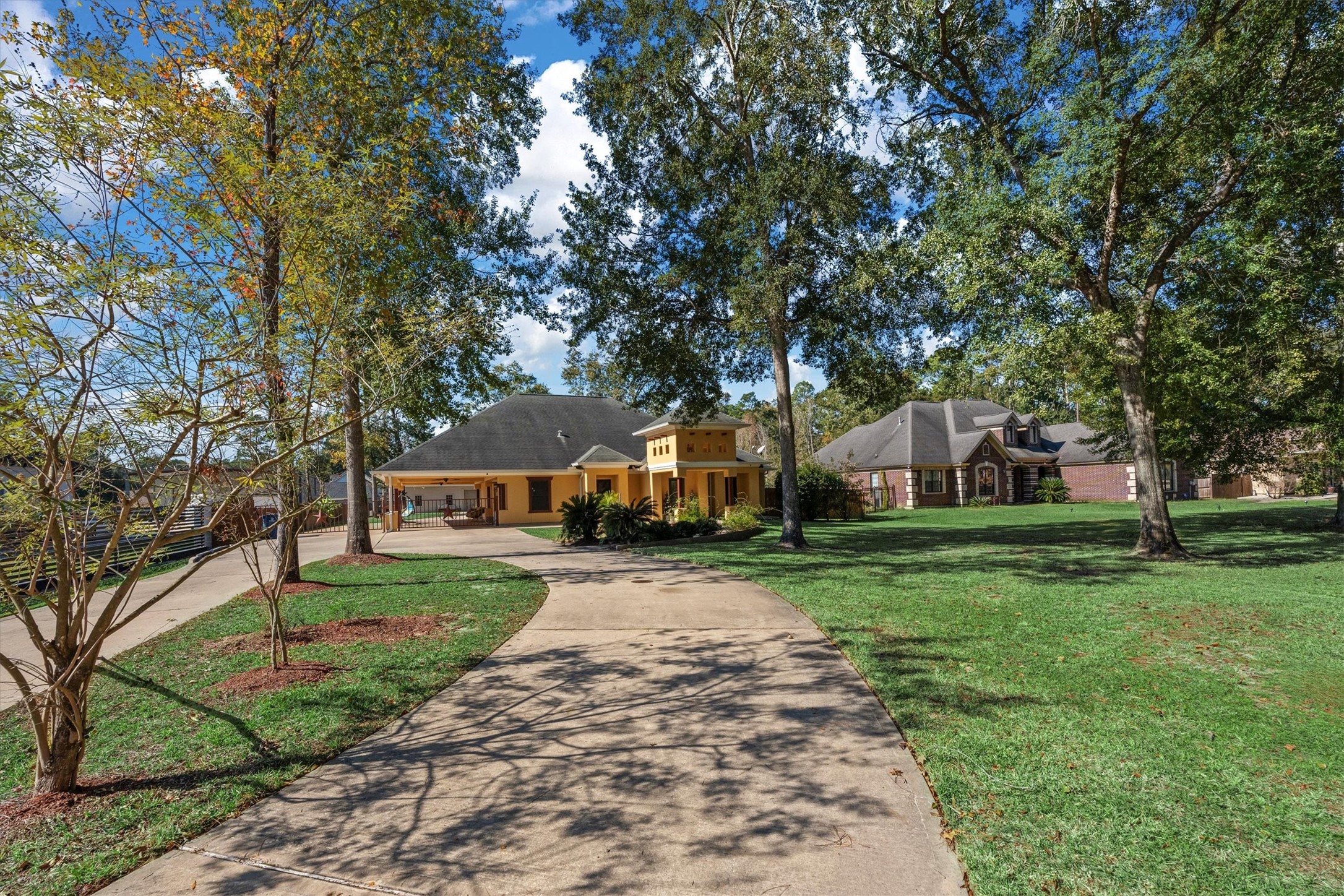 22924 Rio Grande Drive Porter, TX 77365 - Photo 2 of 19 a front view of a house with a garden