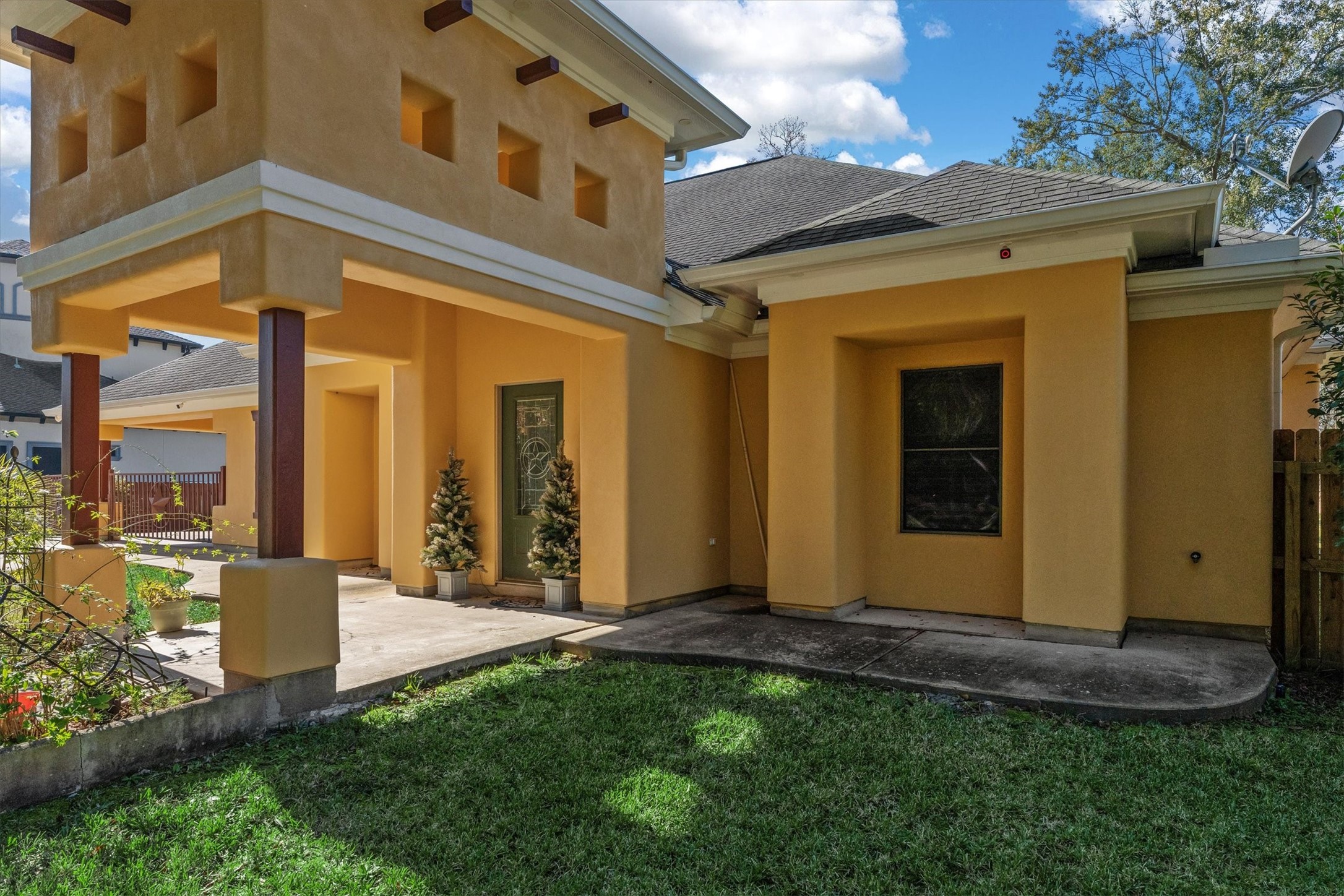 22924 Rio Grande Drive Porter, TX 77365 - Photo 3 of 19 a view of a house with many windows and a yard