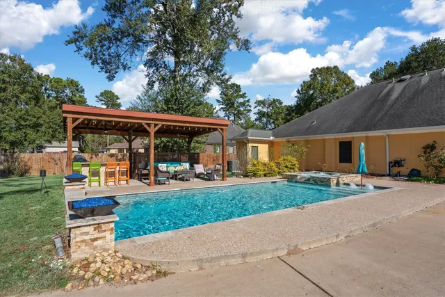 a front view of a house with porch and garden