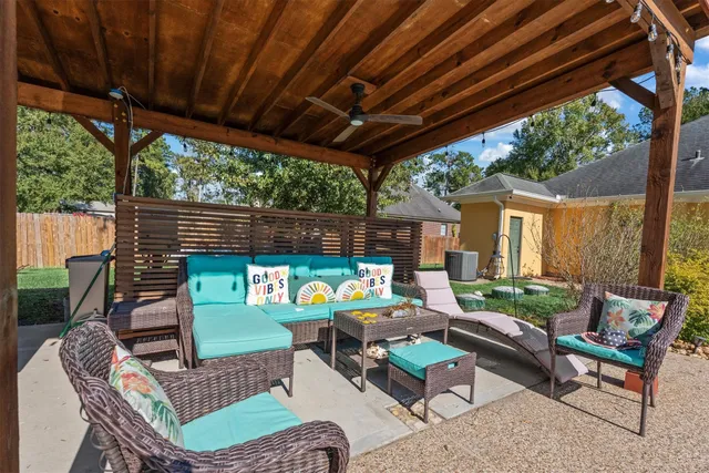 a backyard of a house with outdoor seating