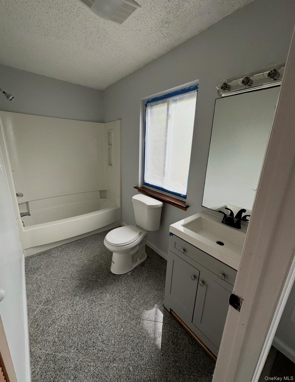 15 Fox Ridge Woodridge, NY 12789 - Photo 11 of 25 a bathroom with a sink a toilet and shower