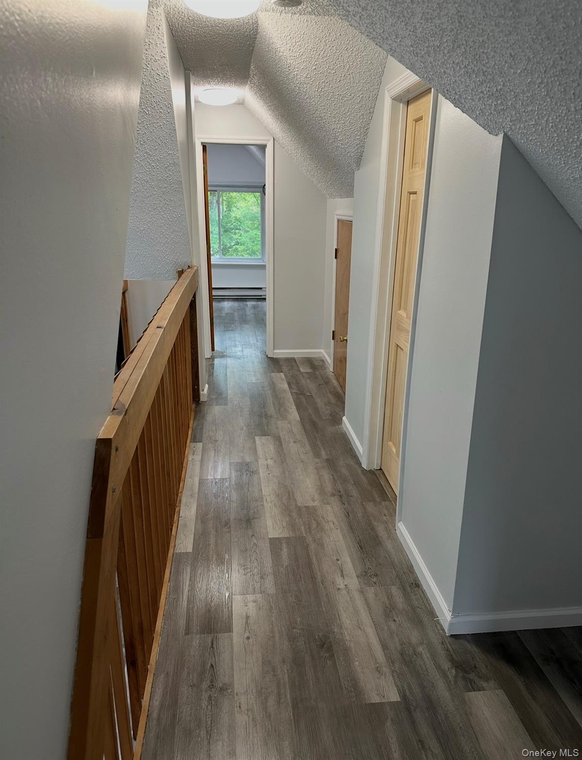 15 Fox Ridge Woodridge, NY 12789 - Photo 13 of 25 a view of a hallway with wooden floor and staircase