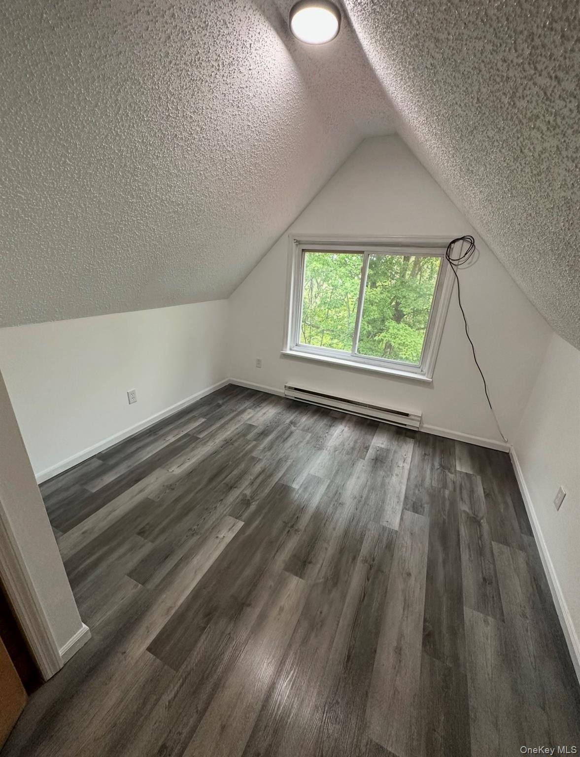 15 Fox Ridge Woodridge, NY 12789 - Photo 19 of 25 an empty room with wooden floor and windows