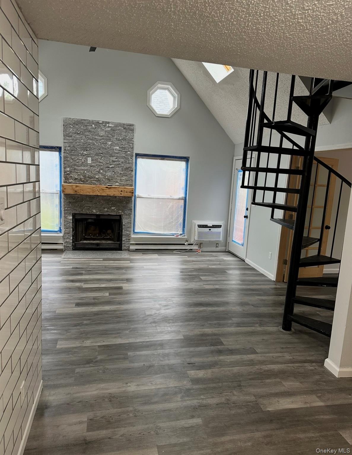 15 Fox Ridge Woodridge, NY 12789 - Photo 23 of 25 a view of an empty room with wooden floor fireplace and a window