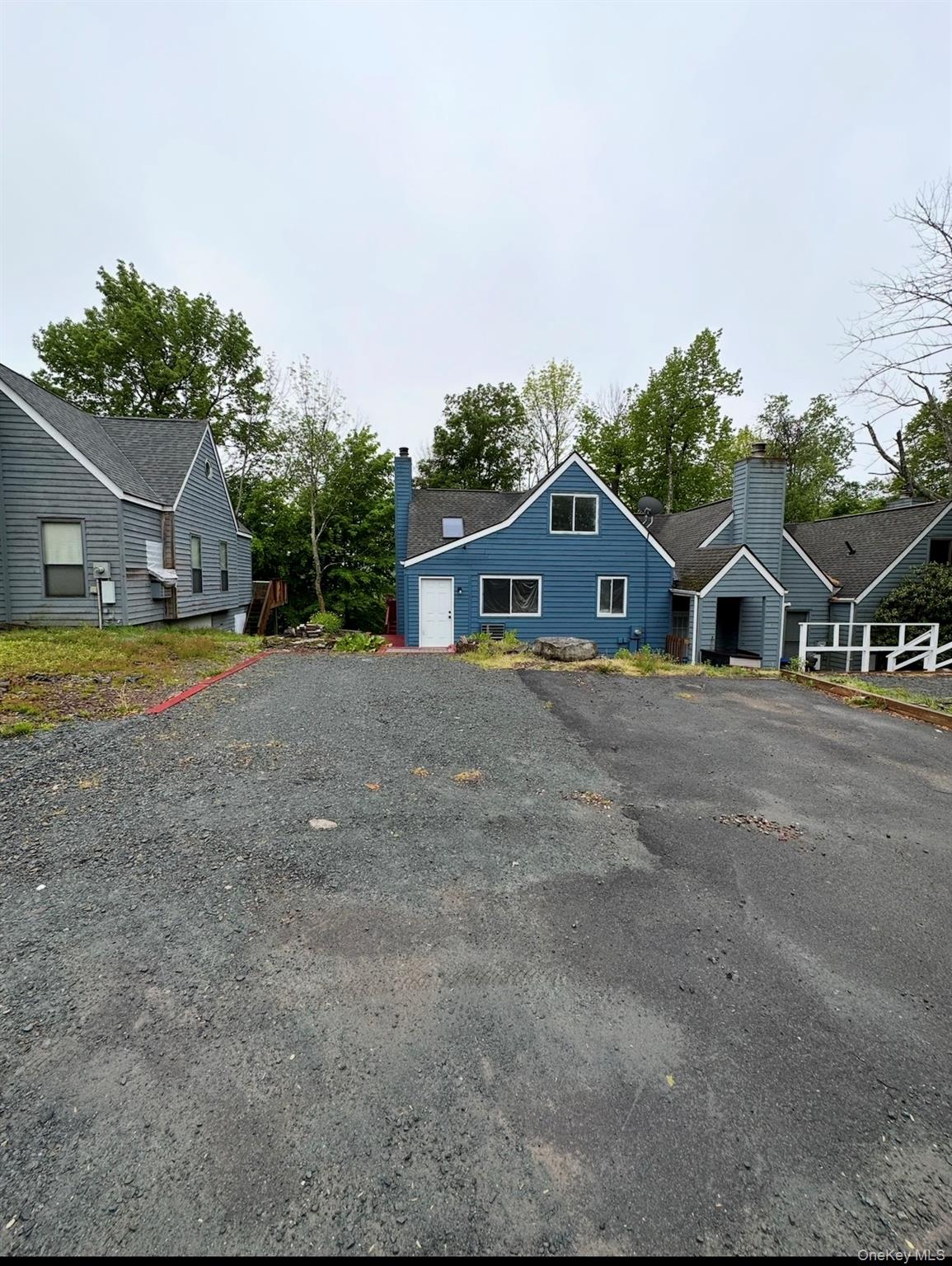 15 Fox Ridge Woodridge, NY 12789 - Photo 24 of 25 a front view of a house with a yard and garage
