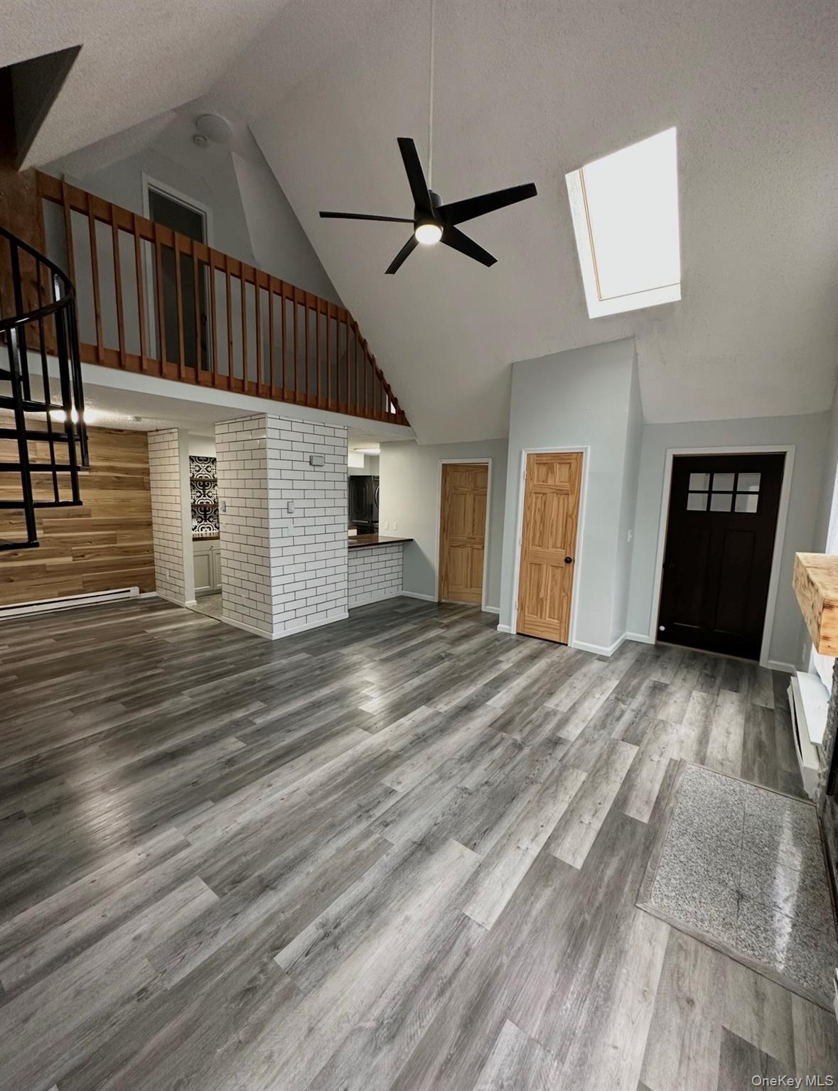 15 Fox Ridge Woodridge, NY 12789 - Photo 3 of 25 a view of a livingroom with wooden floor and a ceiling fan