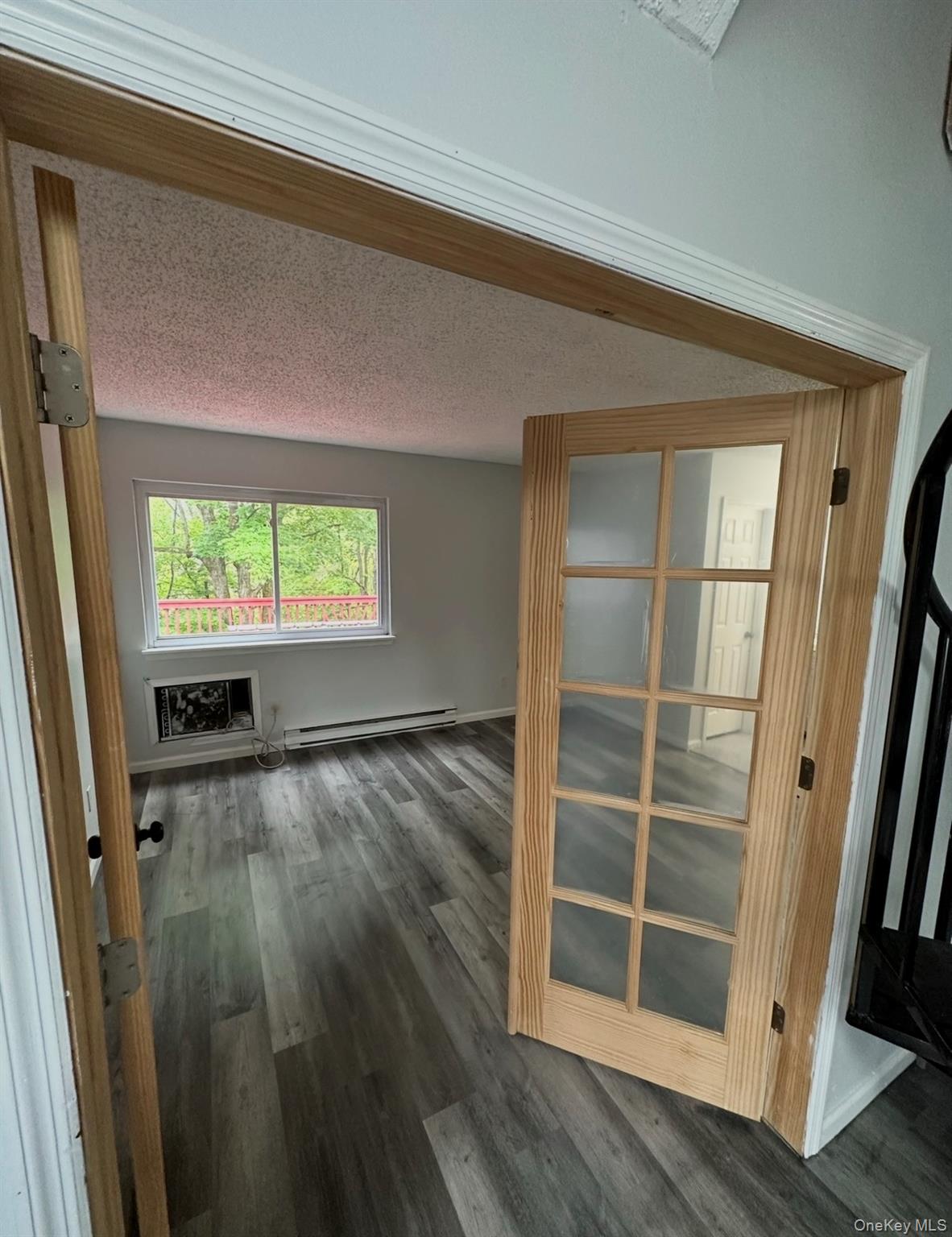 15 Fox Ridge Woodridge, NY 12789 - Photo 6 of 25 a view of an empty room with wooden floor and a window