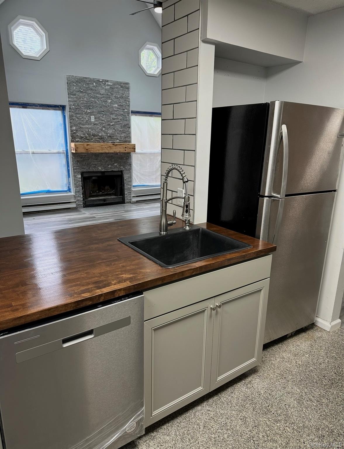 15 Fox Ridge Woodridge, NY 12789 - Photo 8 of 25 a kitchen with stainless steel appliances granite countertop a refrigerator a stove and a sink