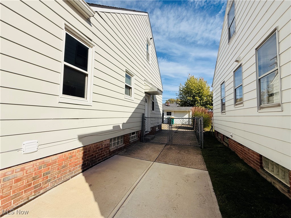 5239 Arch Street Maple Heights, OH 44137 - Photo 25 of 25 View of side of property featuring a patio and a gate