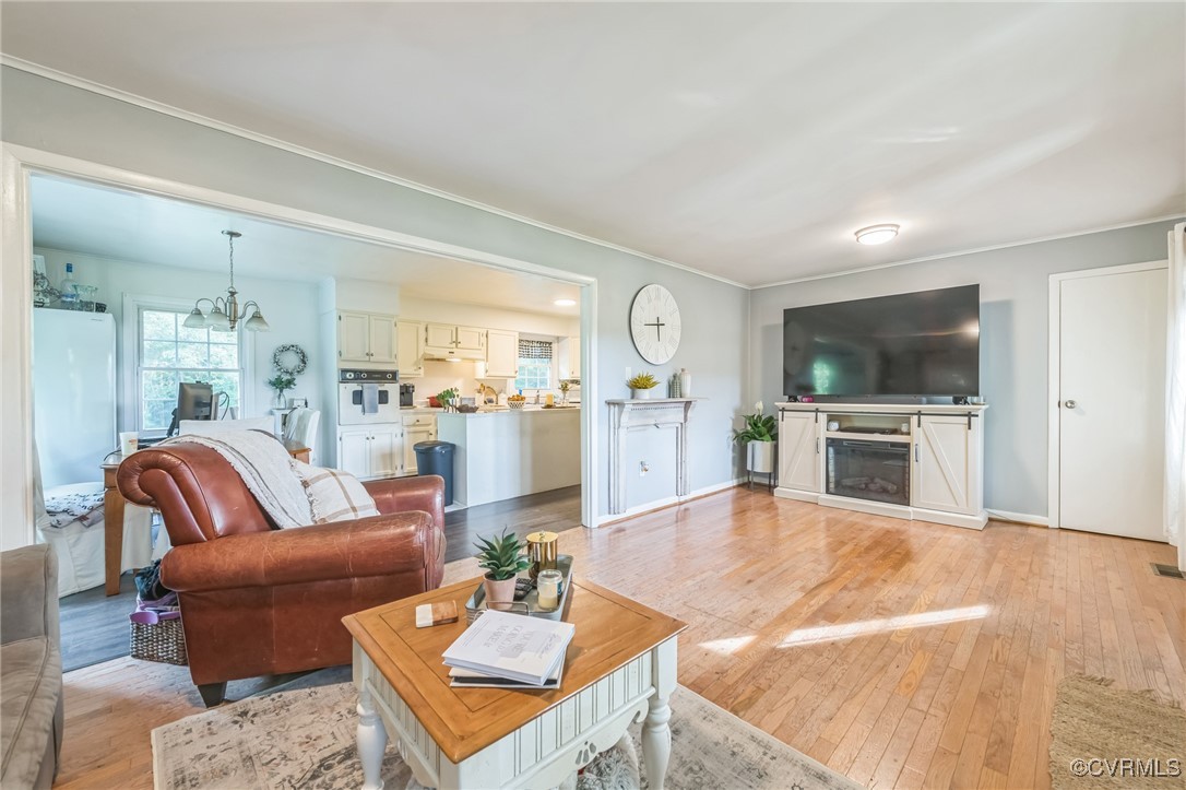 2301 White Chapel Road Lancaster, VA 22503 - Photo 8 of 18 Living area with light wood-style flooring, orname
