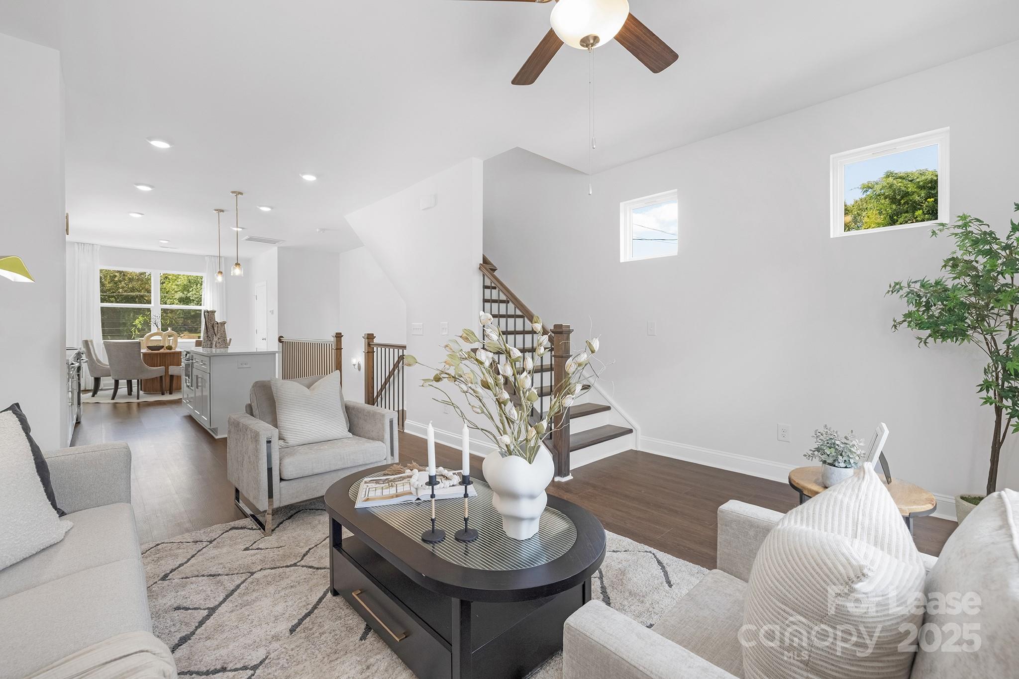 550 Beatties Ford Road Charlotte, NC 28216 - Photo 11 of 23 a living room with furniture and a chandelier