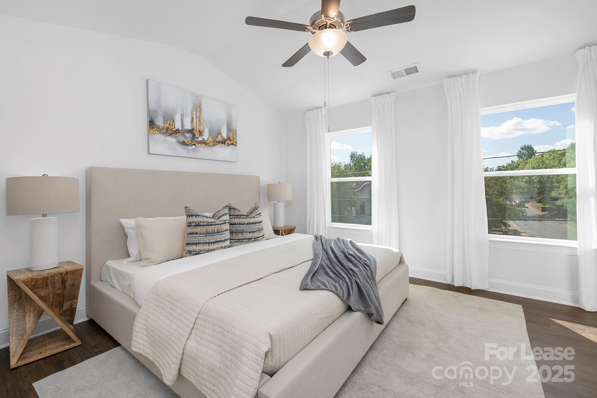 550 Beatties Ford Road Charlotte, NC 28216 - Photo 12 of 23 a bedroom with a large bed and a window