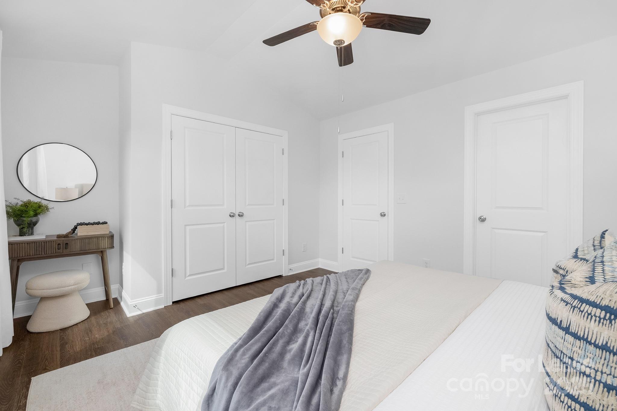 550 Beatties Ford Road Charlotte, NC 28216 - Photo 13 of 23 a bedroom with a bed and chandelier