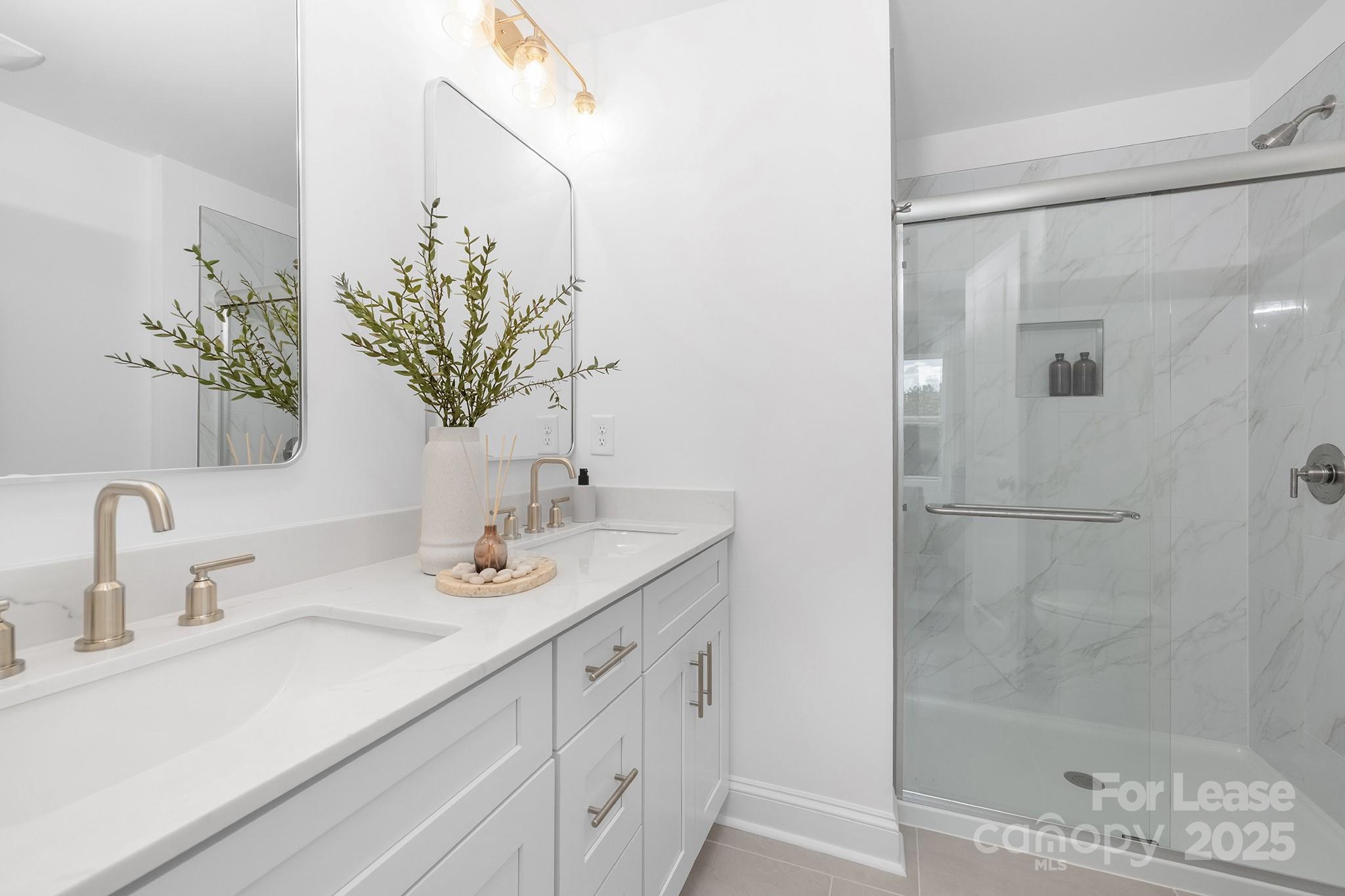 550 Beatties Ford Road Charlotte, NC 28216 - Photo 14 of 23 a bathroom with a sink and a mirror