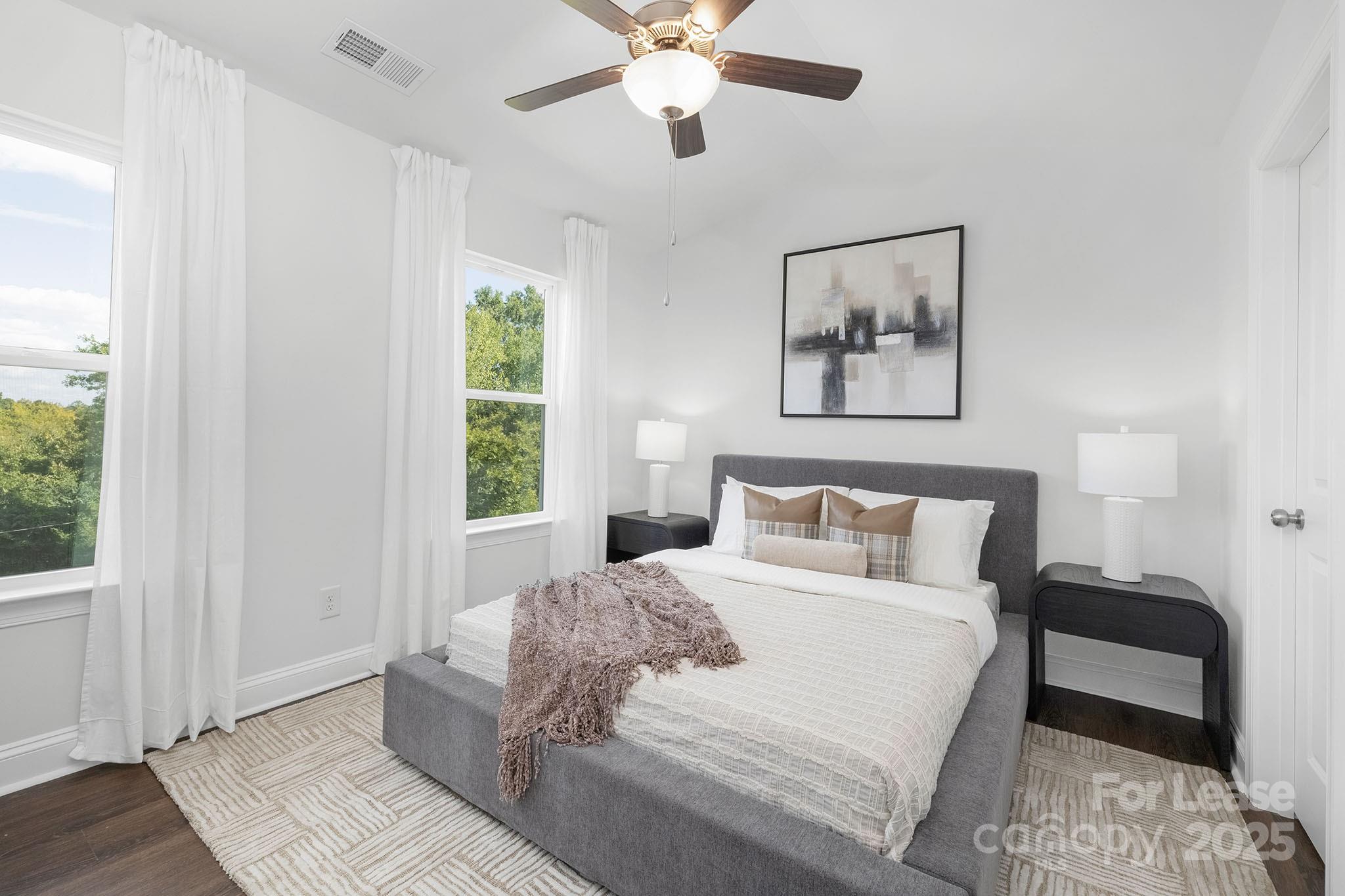 550 Beatties Ford Road Charlotte, NC 28216 - Photo 15 of 23 a bedroom with a large bed and a window