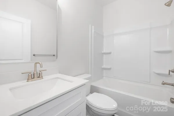 a bathroom with a sink a toilet and a bathtub