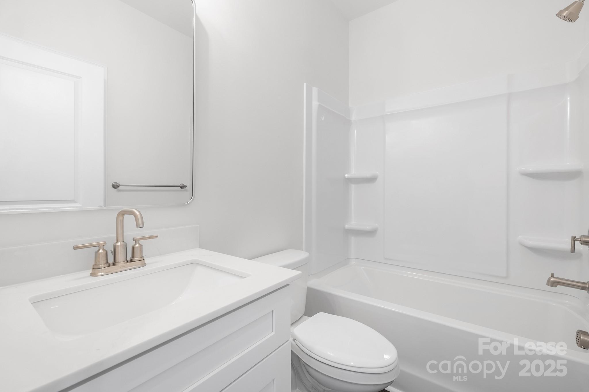 550 Beatties Ford Road Charlotte, NC 28216 - Photo 17 of 23 a bathroom with a sink a toilet and a bathtub