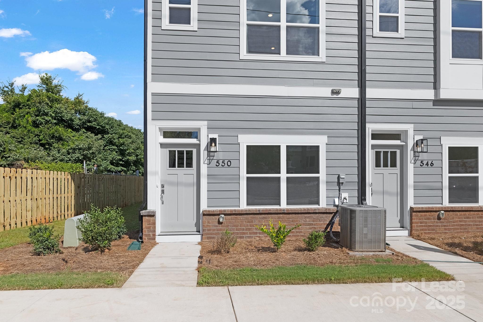 550 Beatties Ford Road Charlotte, NC 28216 - Photo 2 of 23 a front view of a house with garden