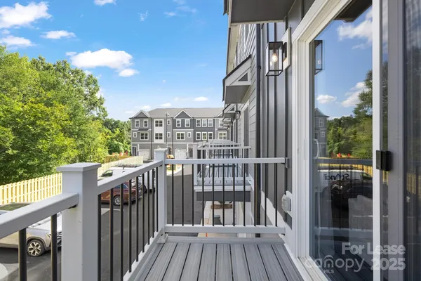 a view of a balcony with wooden floor