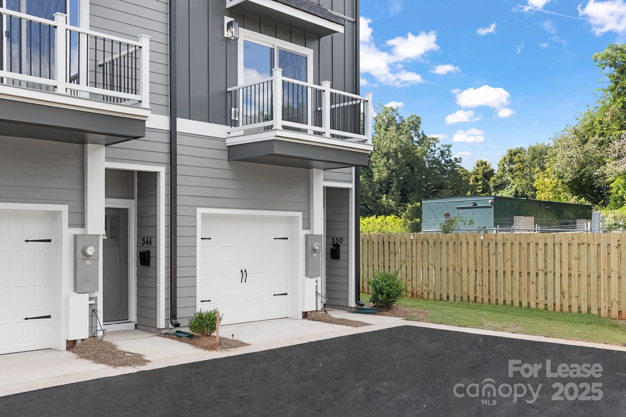550 Beatties Ford Road Charlotte, NC 28216 - Photo 22 of 23 a front view of a house with a garage